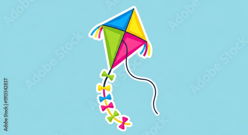 Colorful kite with multicolored tail flies high in clear blue sky on windy day outdoors