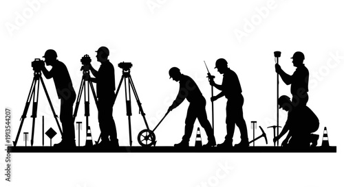 Silhouetted figures working with surveying equipment on a construction site from a side viewpoint