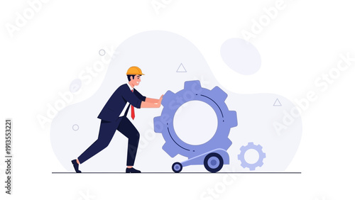 Engineer pushes large gear wheel, symbolizing teamwork and industrial production