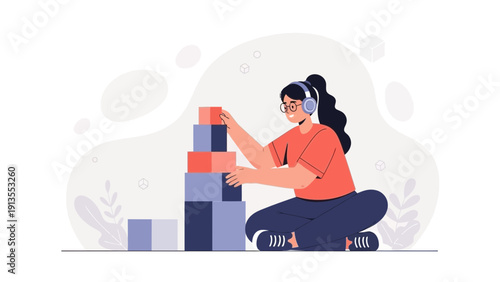Girl with headphones building tower with blocks, creative play, childhood fun