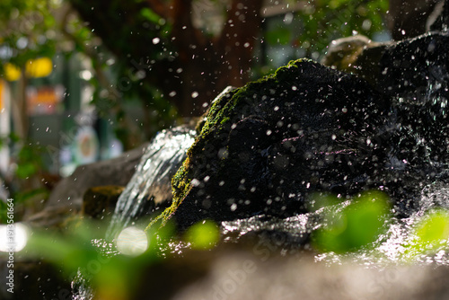 Close-up of Mossy Rocks with Flowing Water
