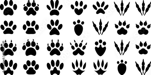Collection of black paw prints and animal tracks on a white background