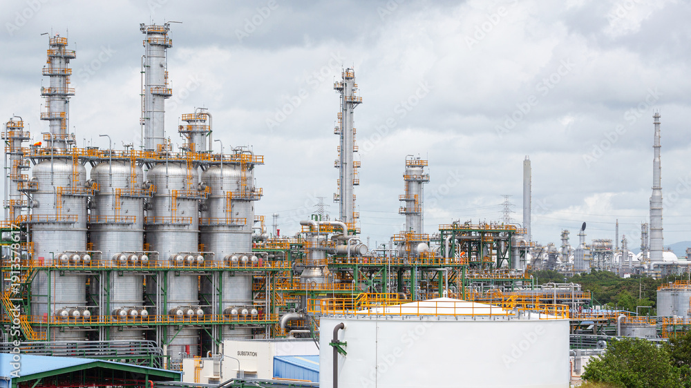 Fototapeta premium Landscape view of an oil refinery and chemical plant with a blue sky background,