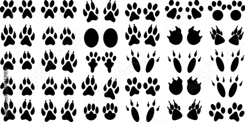 A repeating pattern of black paw prints and oval shapes on white