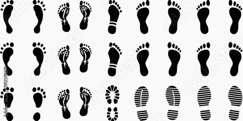 Collection of black footprints and shoe prints on a white background