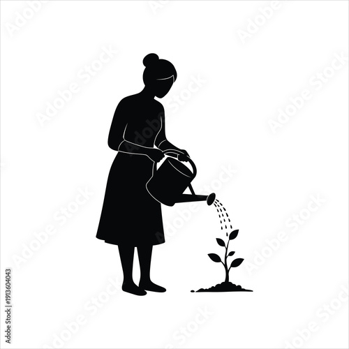 Silhouette of a woman watering a small plant with a watering can in a garden setting.