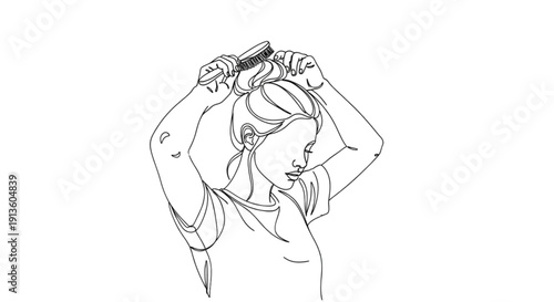 Young woman brushing hair into bun with a hairbrush indoors  