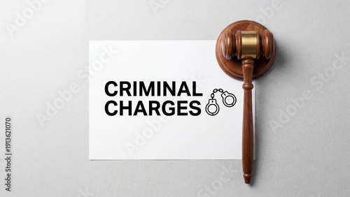  Criminal charges legal documentation representing prosecution proceedings arrest warrant indictment and criminal justice system enforcement for defense attorney representation and court trial