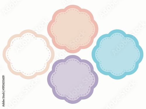 Four decorative floral shaped labels in pastel colors arranged on a white background
