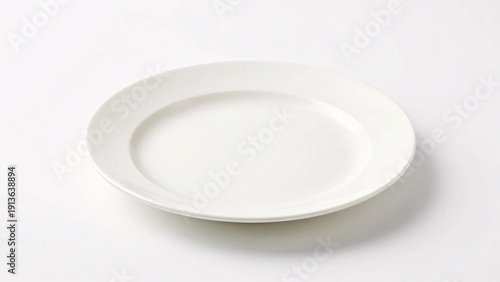 A classic round white ceramic plate sits isolated on a clean white background, providing a perfect minimalist template for food presentation or dining mockups.