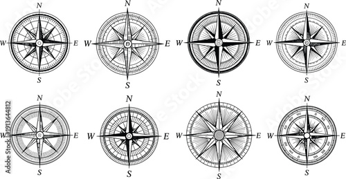 Black and white vector illustration of vintage compass rose designs with cardinal directions, ornate pointers, concentric circles, and navigation symbols