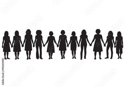 A lone tree stands against a vibrant orange and yellow sunset creating a striking silhouette