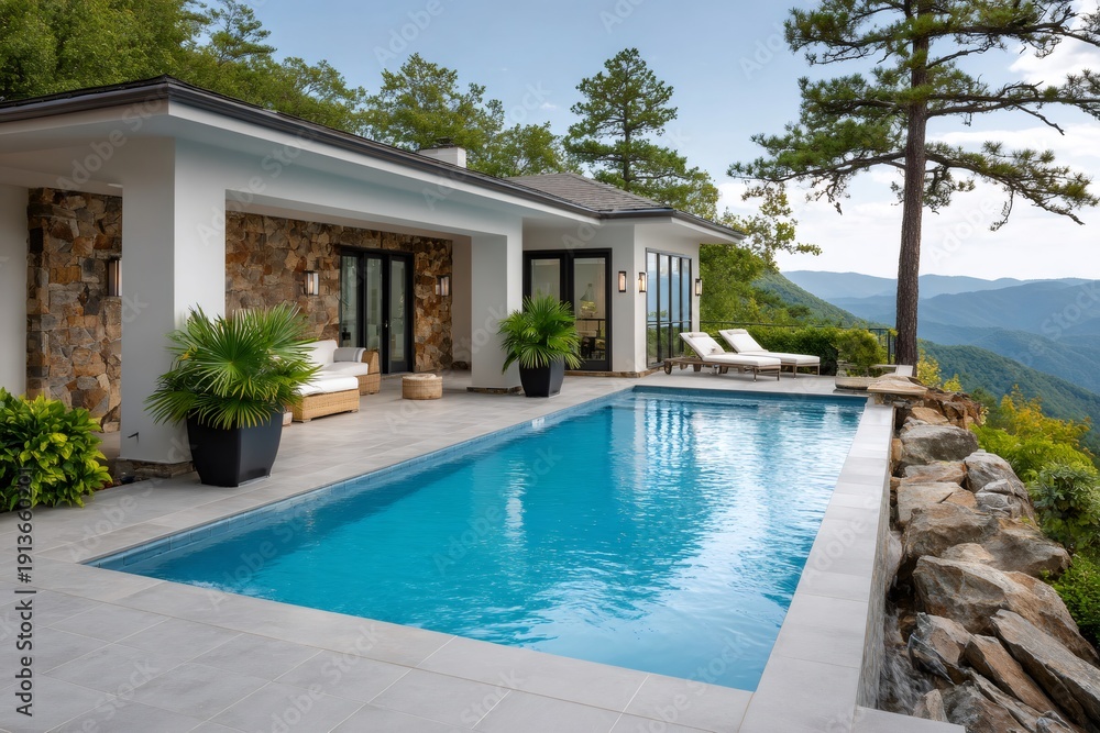 Fototapeta premium Luxury villa infinity pool overlooking mountain range