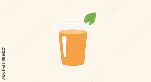 A refreshing glass of orange juice with a green leaf garnish.