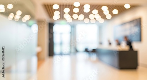 Blurred Modern Office Lobby with Bright Lights and Reception Desk.