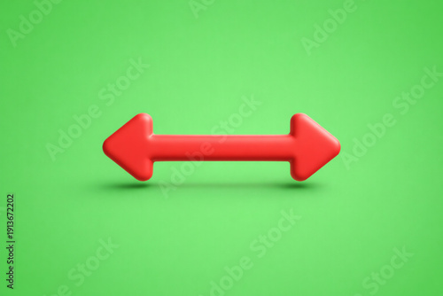 A 3D horizontal red arrow with heads pointing in opposite directions (left and right), isolated on a soft green background. This graphic represents lateral expansion, width, bilateral communication, 