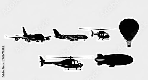 Collection of Silhouetted Aircraft and Airships Flying.