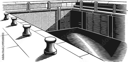 Empty harbor dock with mooring bollards and calm water in black and white