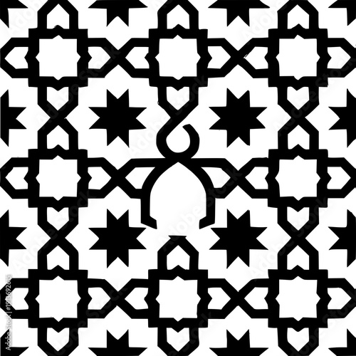 Intricate islamic geometric pattern featuring interlocking star and floral motifs in black and white