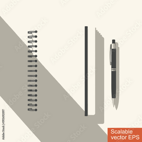 A close-up view of a notebook and pen on a clean surface, ready for writing or journaling, with shadows cast on a light background