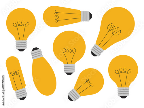 Collection of yellow incandescent light bulbs with visible filaments white background