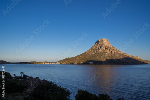 View of the rugged Telendos island in Greece as seen from Kalymnos on a sunny day.