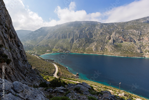 View of mountainous and rugged landscape, coastline, the Aegean Sea and the Arginonta valley on Kalymnos island in Greece on a sunny day.