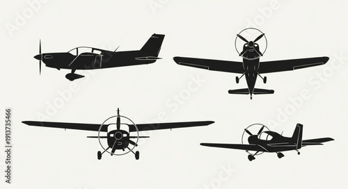 Four Silhouettes of Small Airplanes in Different Views.