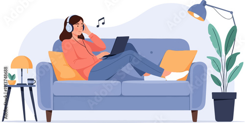 Woman relaxing on sofa with laptop and headphones, listening to music