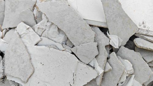 Bild auf Leinwand Close-up of Broken Gypsum Board and Drywall Debris from Home Renovation