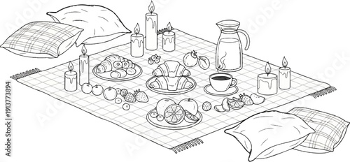 Cozy picnic with pastries, fruits, coffee, and lit candles on a blanket