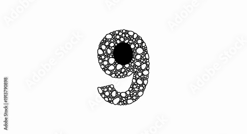 Number nine made of small stones and a central black circle