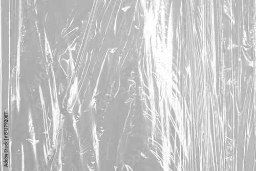 Transparent wrinkled plastic, white plastic or polyethylene bag texture, macro, no background