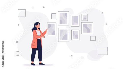 Woman Decorating Wall with Framed Pictures in Art Gallery