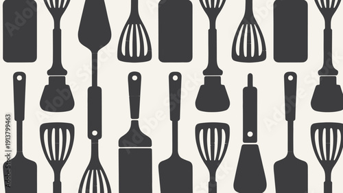Kitchen utensils and cutting boards in dark gray on beige background