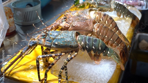 Traditional daily life in Vietnam in Hoi An -lobster shellfish  fruit and vegetable market, street food stalls, Asian specialties - Vietnamese culinary tradition 