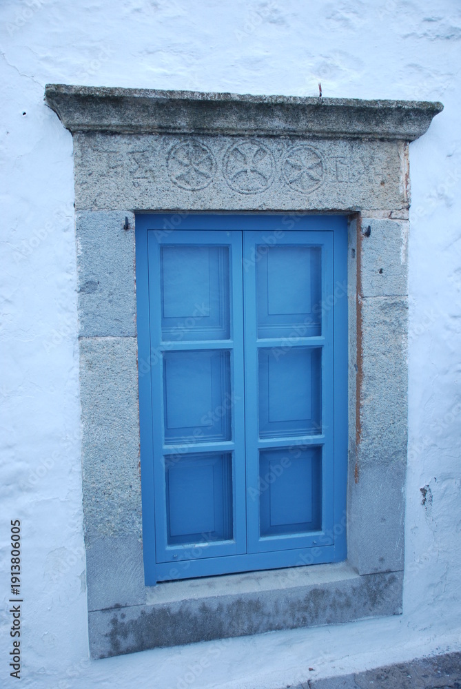 Fototapeta premium old window with shutters, Patmos island, Greece