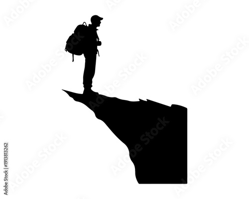 Hiker silhouette standing on sharp mountain cliff edge, adventure and travel concept