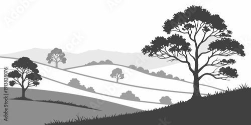 Silhouette of trees and hills under a clear sky in a serene landscape.