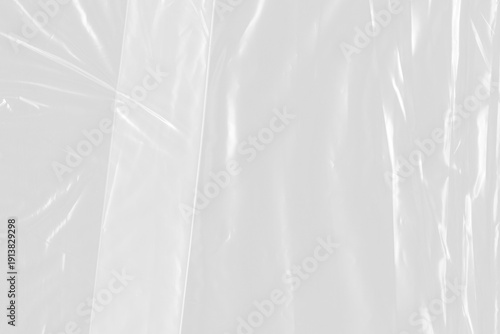 Fotografie Clear plastic sheet with glossy light reflections isolated on a transparent background