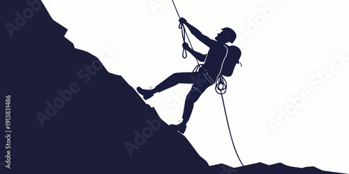 Silhouette of a person rock climbing with ropes and harness equipment