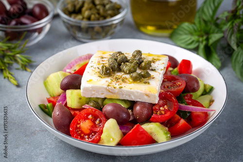 Canvas Print Greek salad with fresh vegetables, feta cheese and kalamata olives