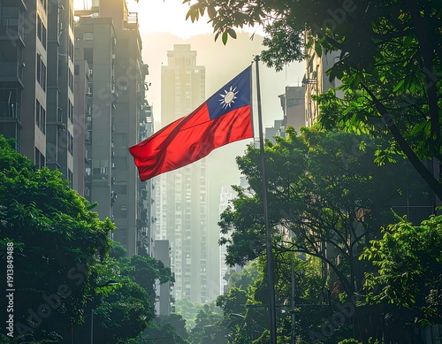 A Taiwanese flag waving in a city surrounded by trees