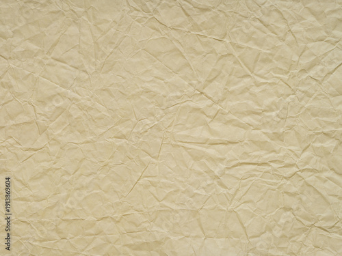 Beige crumpled paper texture. Blank soft page pattern for winter season Christmas festival card, new year designs decoration, background concepts, text, lettering, wall screen saver or other art work.