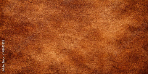 A worn brown leather texture background with a vintage grunge parchment pattern on an aged, rough antique surface for a blank wallpaper design