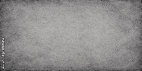 A dark aged grunge paper texture background featuring a rough dirty concrete surface with a vintage grey pattern and weathered stone design