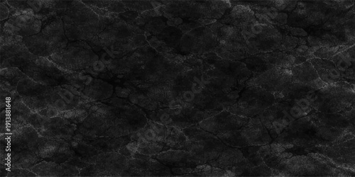 A dark grunge black paper texture with a rough aged surface and vintage grey pattern creates a blank backdrop designed for an old blackboard or stone wall wallpaper