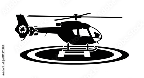 Black silhouette of a helicopter on a helipad with a white background.