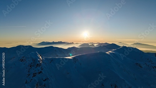 Above the Mist
Snowy ridgelines rising above a sea of clouds.