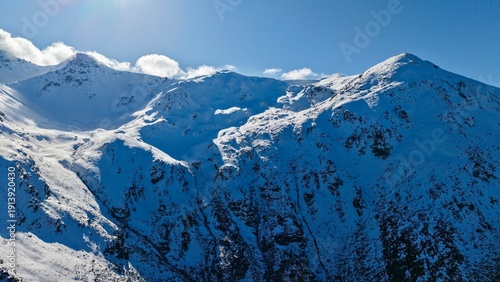 Snow-covered peaks of the Sharr range under low clouds., snow, mountain, winter
